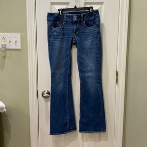 American Eagle Outfitters “Artist” flared leg jeans.